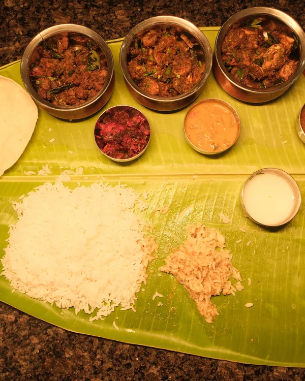 Authentic South Indian meals feast served on a banana leaf at Ponnusamy Hotel Egmore