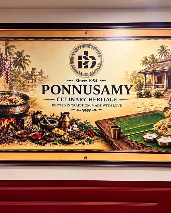 Framed Ponnusamy culinary artwork above burgundy wall panelling